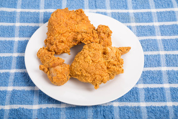 Fried Chicken on White Plate on Blue Plaid Towel