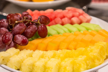 Sliced Pineapple and Melon with Grapes