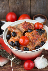 rabbit with tomatoes, olives and thyme