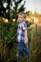 Portrait of a happy young boy outside 