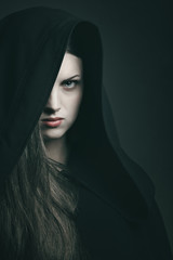 Beautiful vampire with black robe