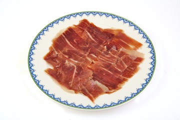 Spanish serrano ham on white background.