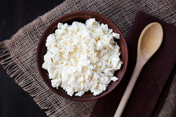 Delicious homemade cottage cheese on the wooden table