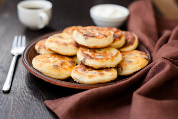 Obraz na płótnie Canvas Delicious homemade cheese pancakes with coffee