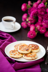 Delicious homemade cheese pancakes with black coffee
