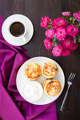 Delicious homemade cheese pancakes with black coffee