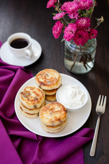 Delicious homemade cheese pancakes with black coffee