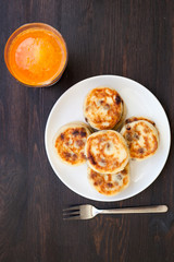 Delicious homemade cheese pancakes with fresh carrot juice