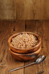 Russian buckwheat kasha in wooden bowl