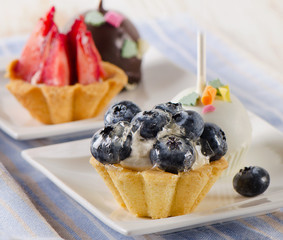 Sweet cakes  on  white plates