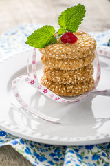 tower stack of cookies with sesame seeds.