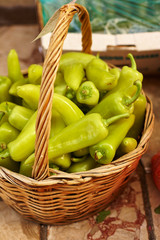 Basket of green peppers at market