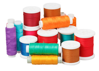 various thread bobbins isolated on white