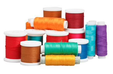 various thread spools isolated on white