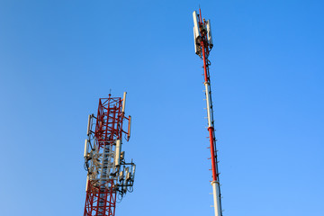 radio communications towers under blue sky