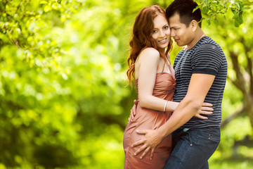 Fototapeta premium loving couple are hugging in park