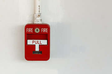 Old red box fire alarm  isolated on white background