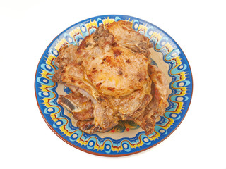 Grilled pork veal on a plate isolated on white background