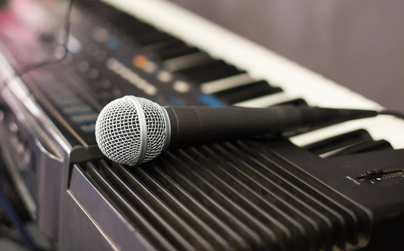 Microphone and electronic keyboard. Are isolated on a white back