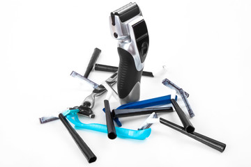 Electric and basic razors on white background