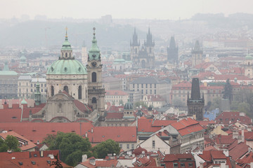 Fototapeta na wymiar Saint Nicholas Church and Tyn Church in Prague, Czech Republic.