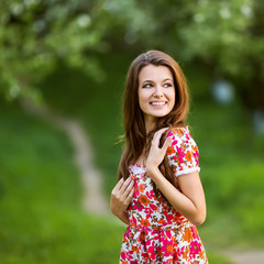 beautiful girl smiling in green park