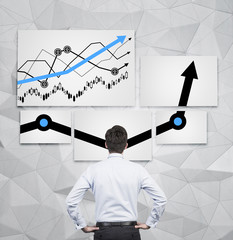 businessman looking to chart