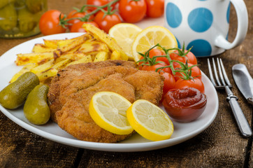 Big Chicken schnitzel with homemade chilli french fries