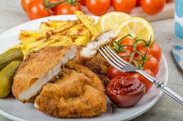 Big Chicken schnitzel with homemade chilli french fries
