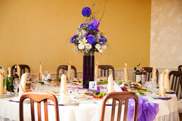 catering table set service with silverware, napkin and glassware