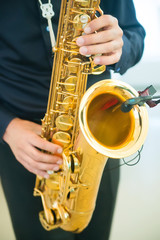 man playing jazz saxophone closeup