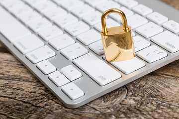 Keyboard and padlock - computer security concept