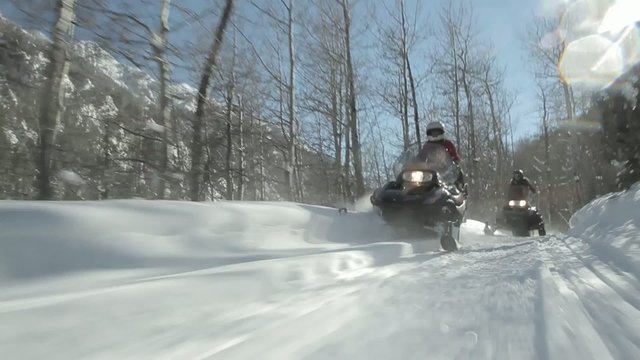 Snowmobilers Aspen Colorado Mountains