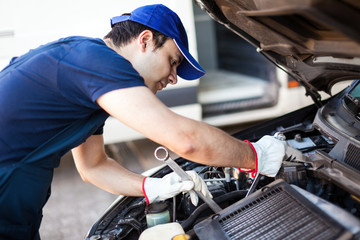 Mechanic fixing a car engine