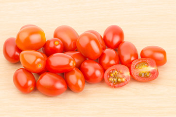 Fresh tomatoes on wooden background