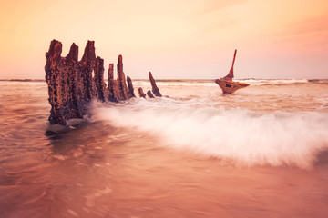 The S.S Dicky Shipwreck at Dicky Beach. Afternoon sunset .