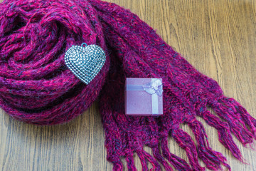 Valentines Day background with gift box Silver heart and scarves