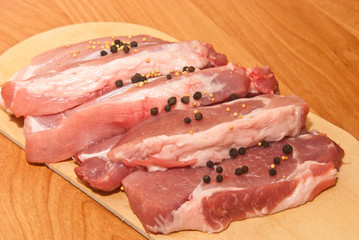 raw meat on a cutting board