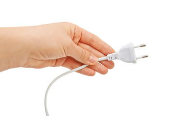 Hand holding electric plug. Isolated on white