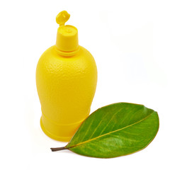 Plastic bottle of lemon juice to the sauce isolated on white bac