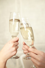 Glasses of champagne in female hands on a party