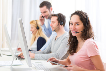 Young attractive woman working in a call center