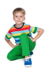 Smiling little boy in the green pants