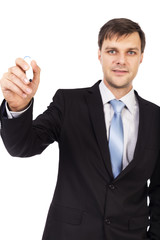 Young businessman writing with marker
