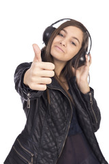 Portrait of happy cute  girl  with headphones listening music an