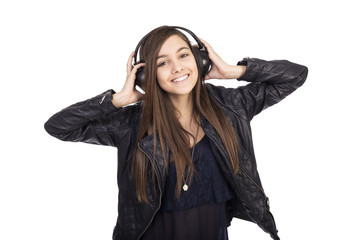 Portrait of happy cute  girl  listening music on her headphones