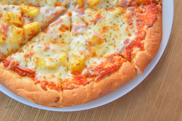 Hawiian pizza hot from oven