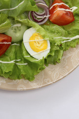 a fresh salad on a plate, closeup