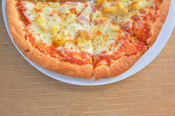 Hawiian pizza hot from oven
