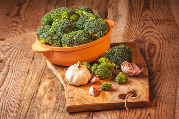 Green delicious broccoli on a wooden rustic table